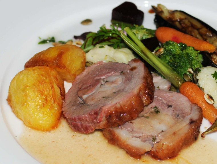 LAMB ROLL STUFFED WITH ROSEMARY AND GARLIC WITH ROAST POTATOES AND MIXED VEGETABLES